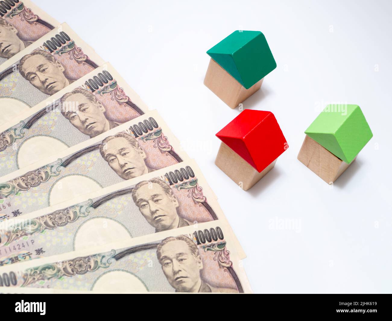 Japanese 10000yen with houses made from blocks. For housing prices, inflation, real estate