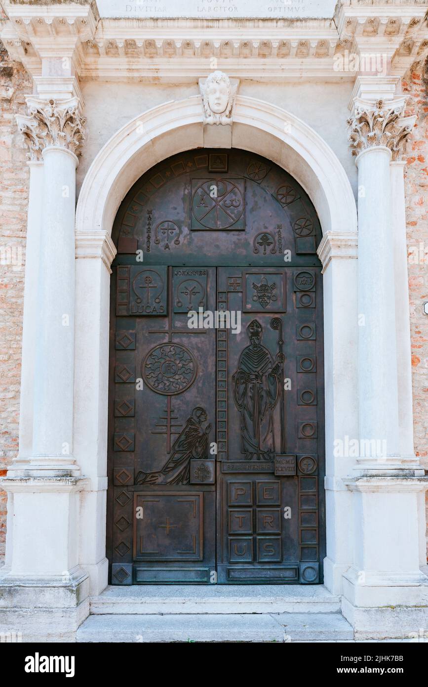 Main entrance door. Belluno Cathedral, Duomo di Belluno, Basilica cattedrale di San Martino. The present building was built between 1517 and 1624, to Stock Photo