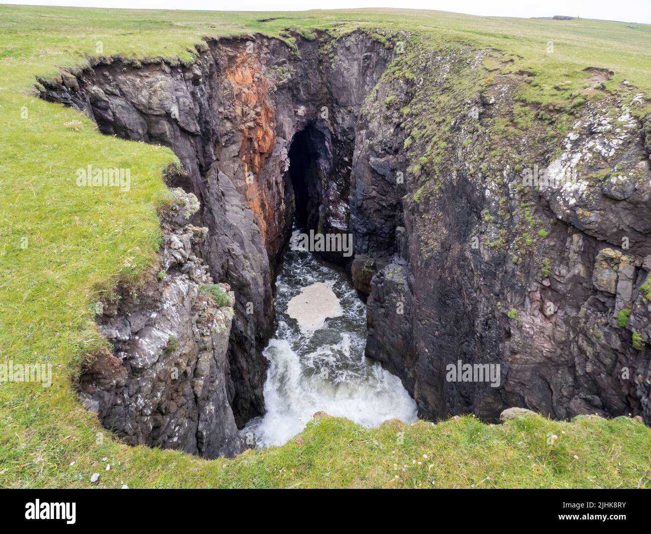The Holes of Scraada, a collapsed sea cave at Esha Ness, Shetland, Scotland, UK. Stock Photo
