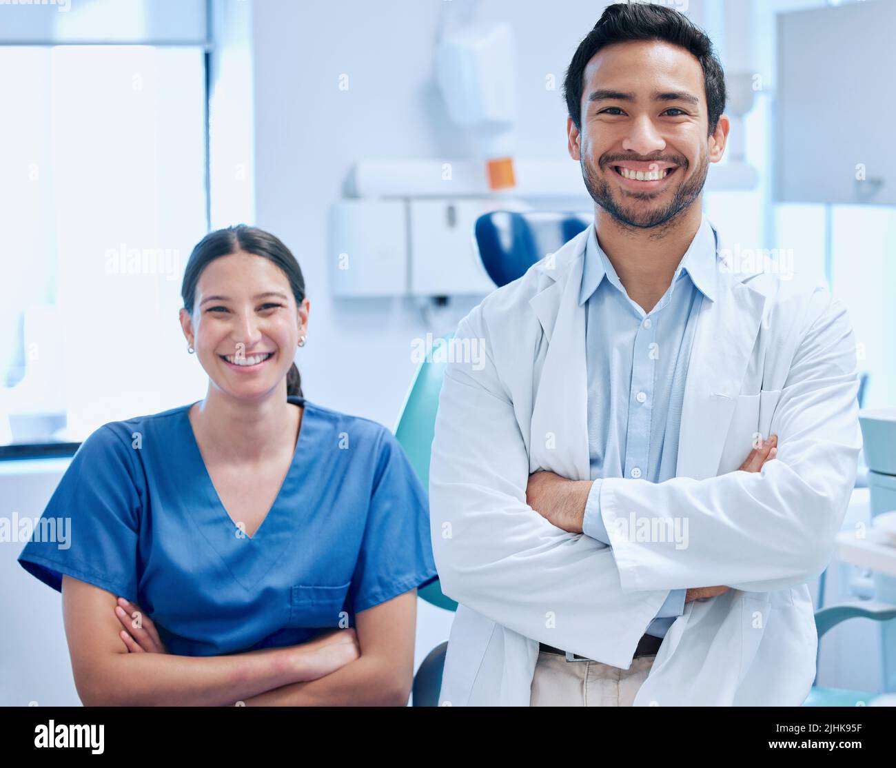 Lets get you smiling again. a young dentist with his nurse together in