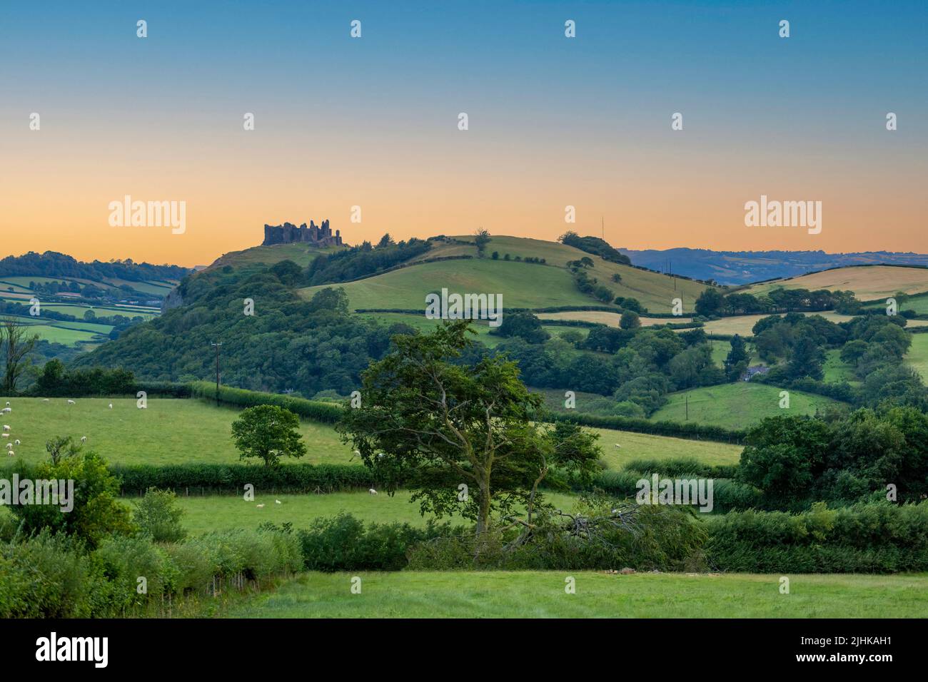 Carreg Cennen castle sitting high on a hill near the River Cennen in the village of Trapp, four miles South of Llandeilo in Carmarthenshire, South Wal Stock Photo
