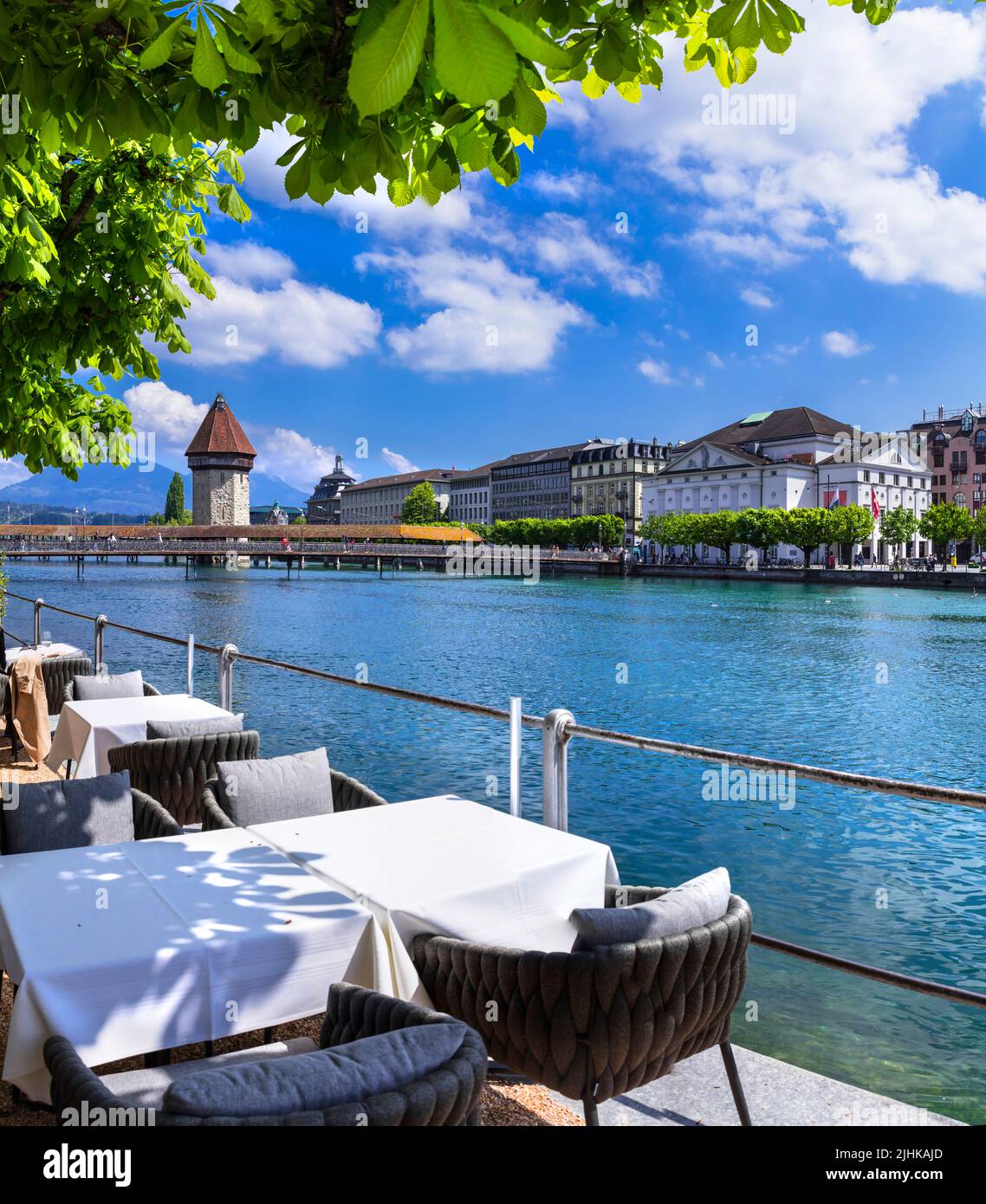 Most beautiful and romantic town and tourist destination in Switzerland -  Luzerne. Restaurant by riverside Stock Photo