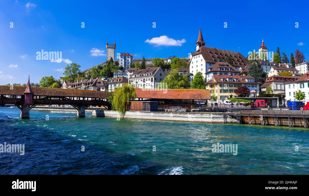 Charming romantic town Luzern, popular tourist attraction in Switzerland. old town with canals and famous wooden bridges Stock Photo