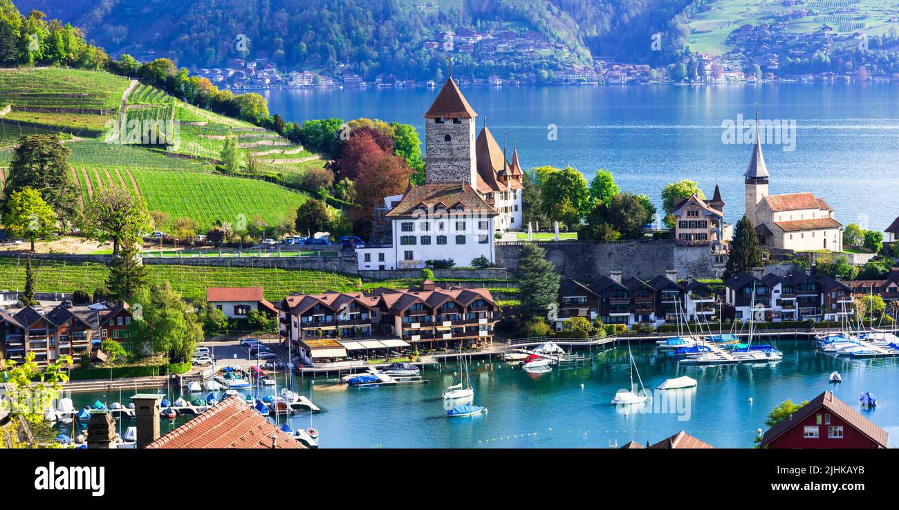 Scenic lake Thun and the Spiez village with its famous medieval castle and old town in the alps in Canton Bern in Switzerland Stock Photo