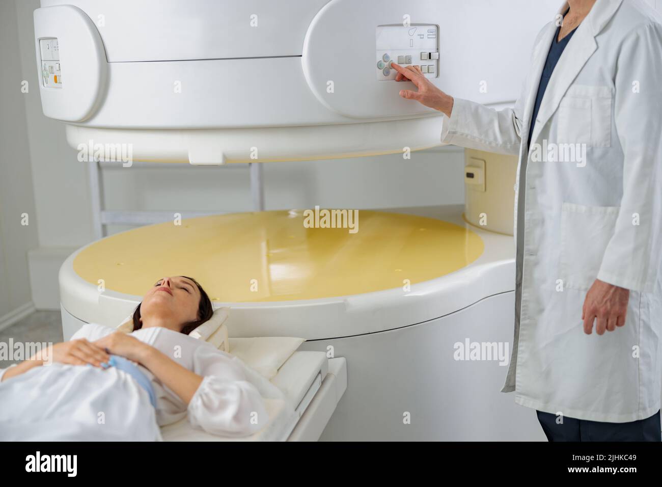 Woman patient is ready to do resonance imaging MRI or CT scan
