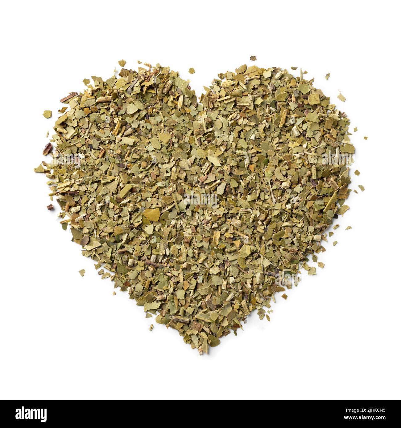 Dried  traditional South American caffeine rich  Mate tea leaves in heart shape close up Stock Photo