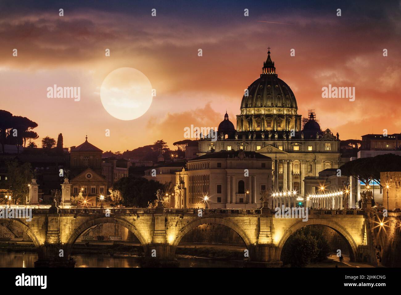 The sun sets behind Vatican City in Rome, Italy. Stock Photo