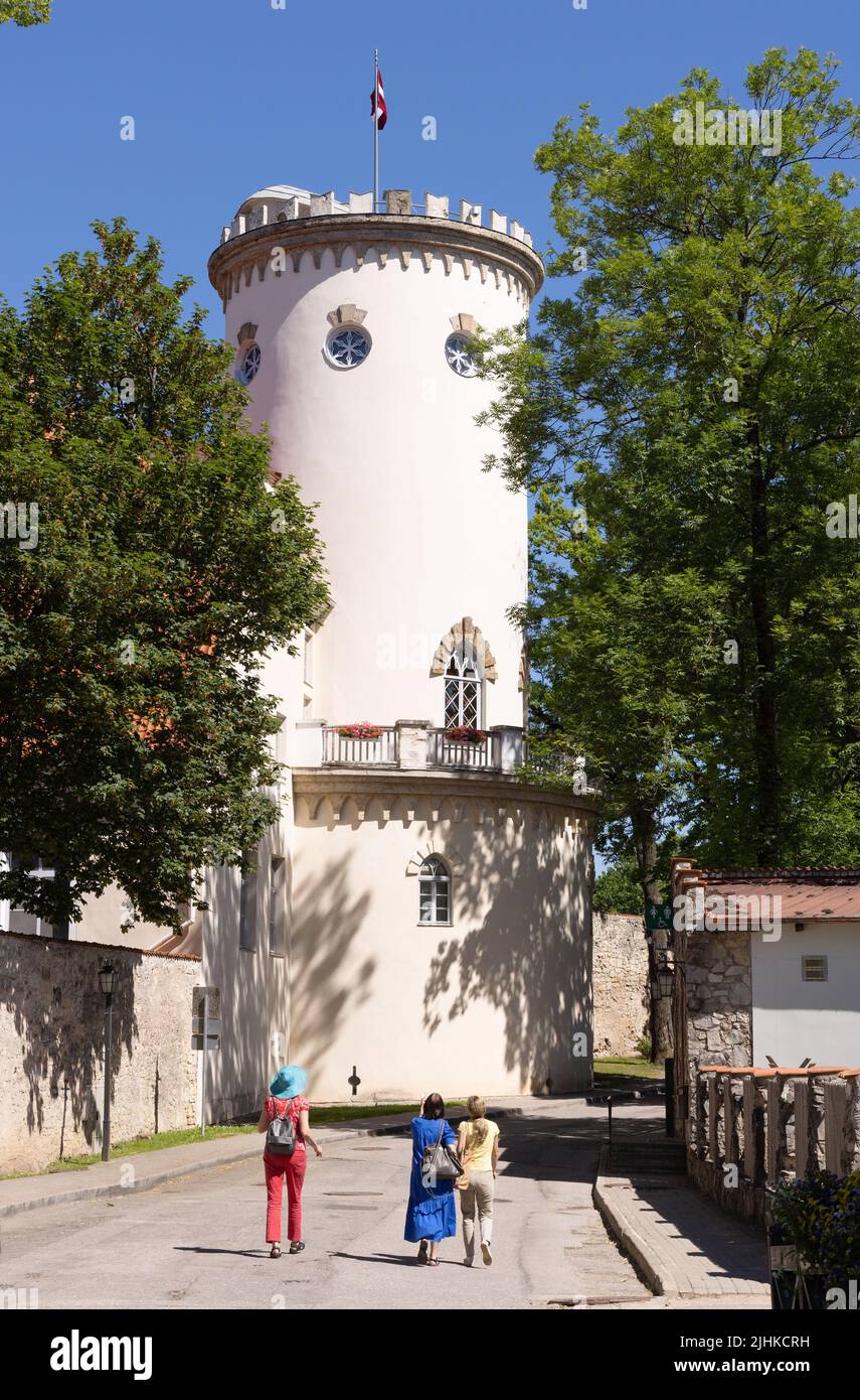 The town of Cesis, Latvia - street scene in summer with tourists and the Tower of Cesis New Castle; Cesis, Guaja, Latvia Europe. Latvia travel. Stock Photo