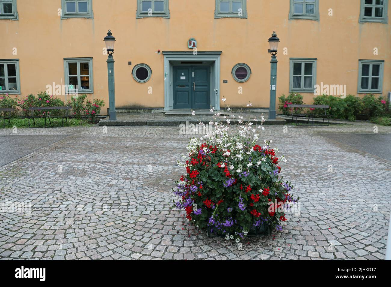 Summer flowers in front of Vaxholm Town Hall Stock Photo