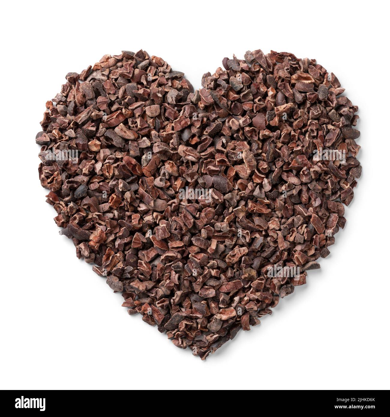 Cacao nibs, dried, crushed and fermented cacao beans in heart shape