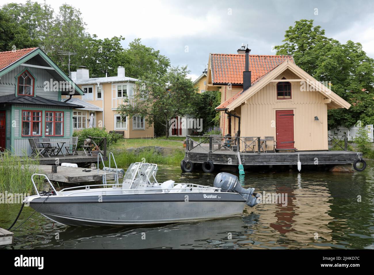 Traditional wooden fishing cottages on the island of Vaxholm in Sweden Stock Photo