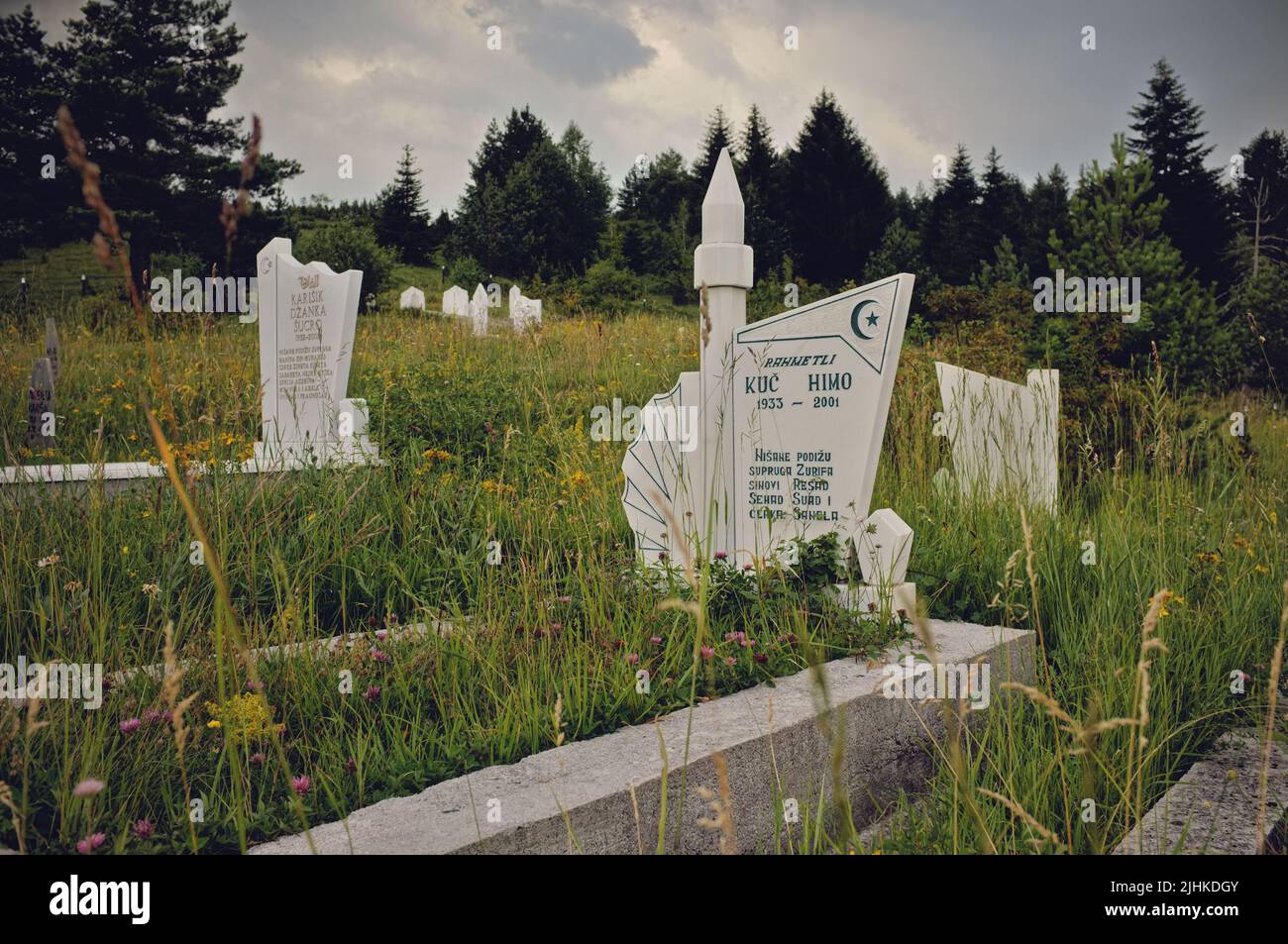 white marble modern gravestones in a muslim cemetery in the mountain of Serbia Stock Photo