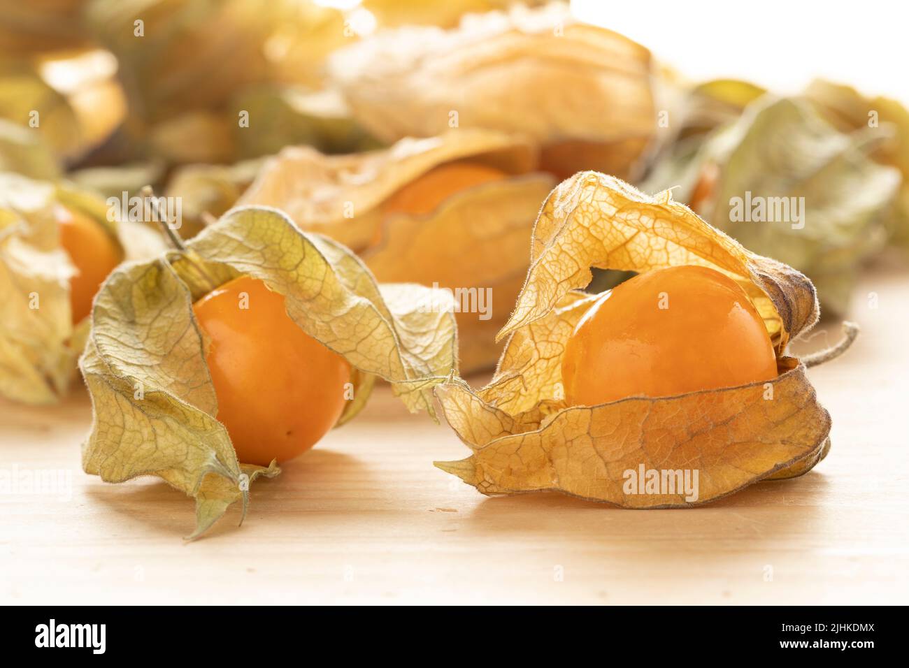 Fresh Cape gooseberry, Physalis Peruviana, with husk on wooden background  close up Stock Photo