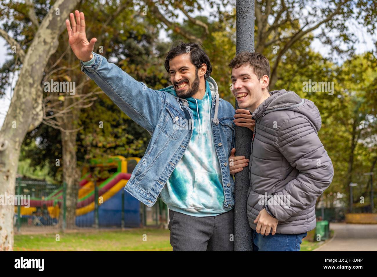Latin gay couple having fun at a park Stock Photo
