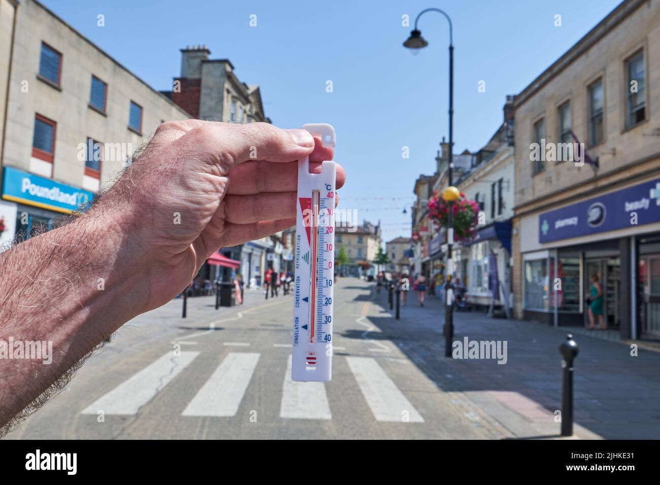 Chippenham, Wiltshire, UK, 19th July, 2022. As the UK reports its highest-ever temperature, breaching 40°C for the first time. The High Street in Chippenham, Wiltshire is quiet on Tuesday afternoon as people heed Met office advice to stay indoors as the temperature peaks. Credit: Lynchpics/Alamy Live News Stock Photo