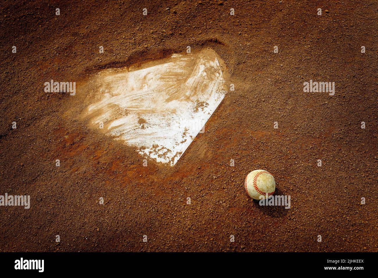 Old leather baseball on dirt field by home plate or a base Stock Photo ...