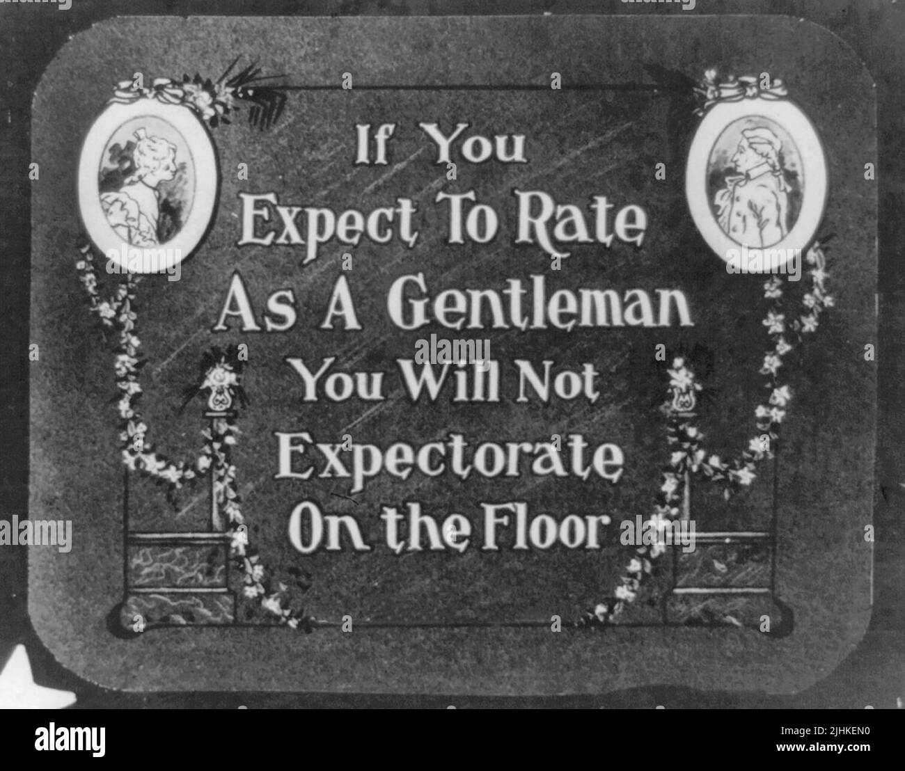 If you expect to rate as a gentleman, you will not expectorate on the floor. Paper print made from lantern slide used as announcemenet in motion picture theaters Stock Photo