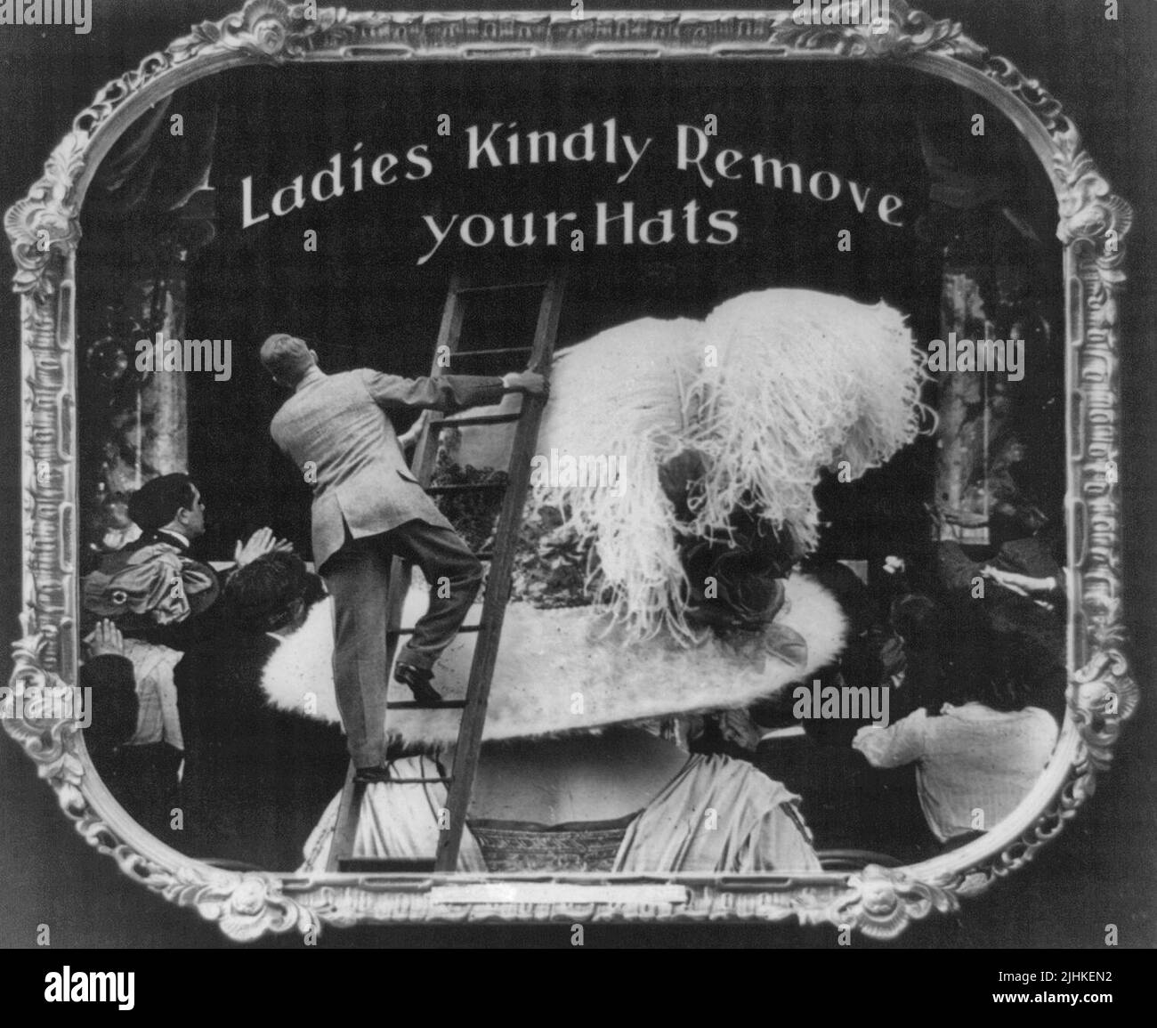 Ladies kindly remove your hats. Positive paper print from lantern slide used in motion picture theaters as announcement Stock Photo