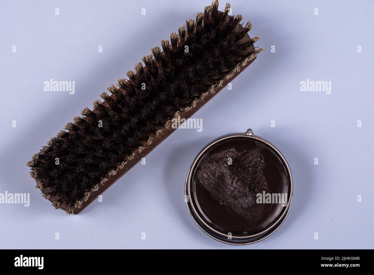 shoe shine brush with wooden handle on light blue background Stock Photo - Alamy