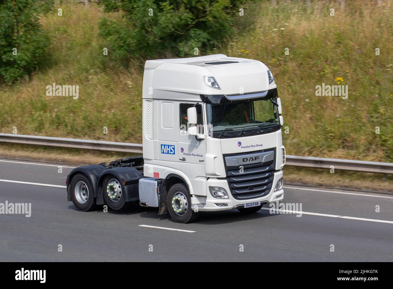 2021 DAF XF 530 NHS Practice Plus Group tractor unit; on the M6 Motorway, UK Stock Photo