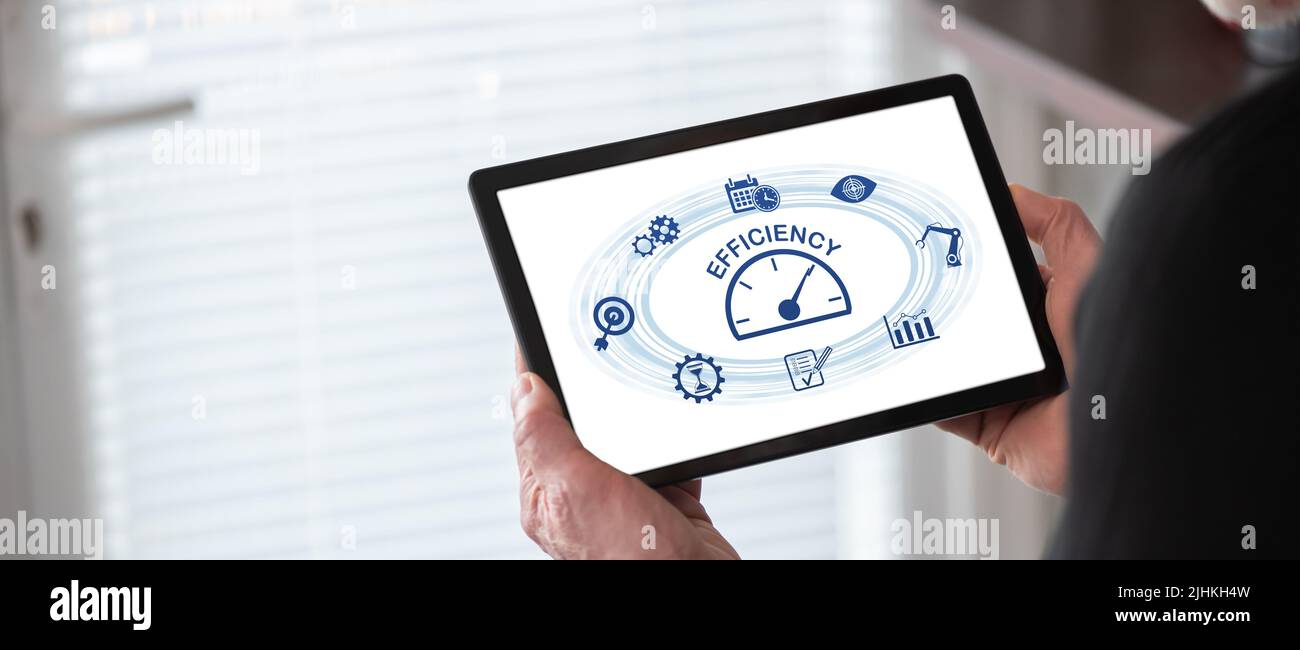 Efficiency concept shown on a tablet held by a man Stock Photo