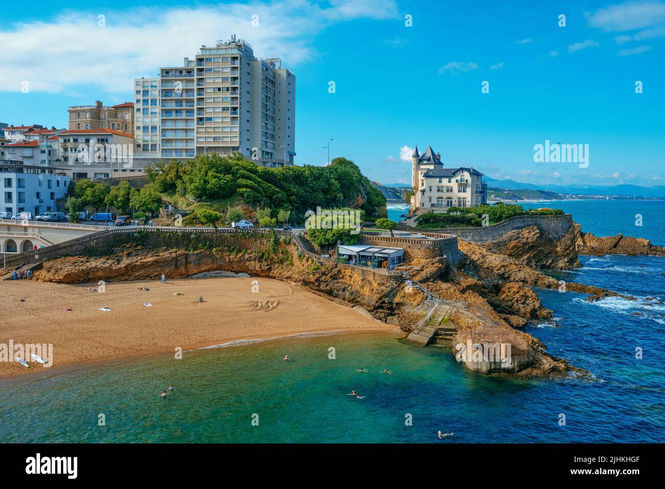 Biarritz, France - June 24, 2022: The Plage du Port Vieux beach in Biarritz, France, with some people enjoying the beach early in the morning in a sum Stock Photo