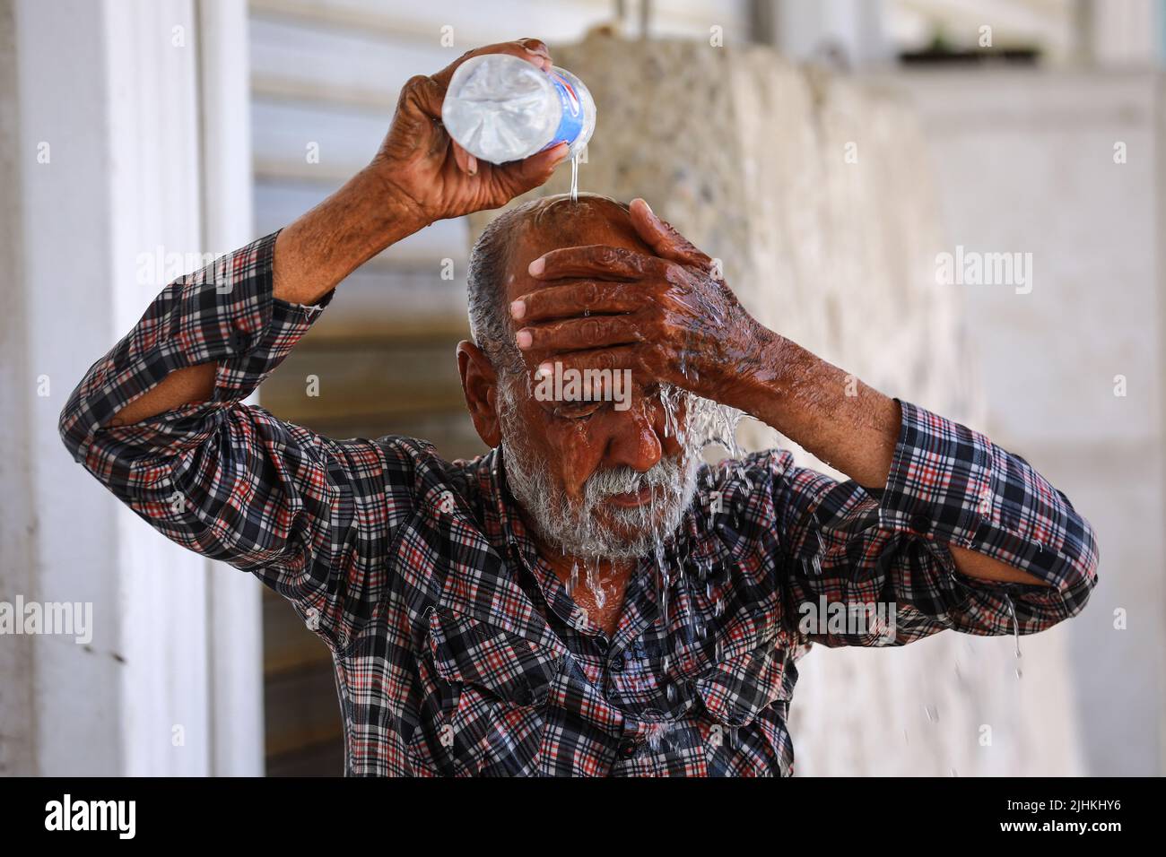 Pouring water over his head hires stock photography and images Alamy
