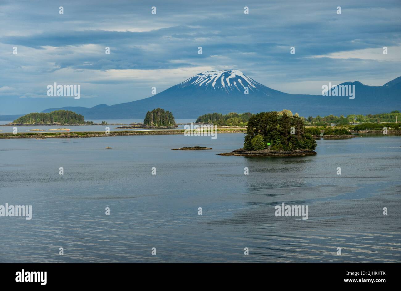 Old volcano of Mt Edgecumbe rises above the islands surrounding Sitka in Alaska Stock Photo