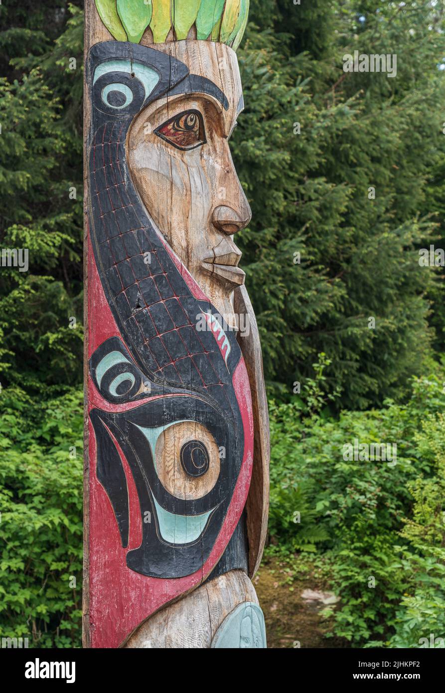 Sitka, AK - 8 June 2022: Totem poles displayed in the Sitka National Historical park in Alaska Stock Photo