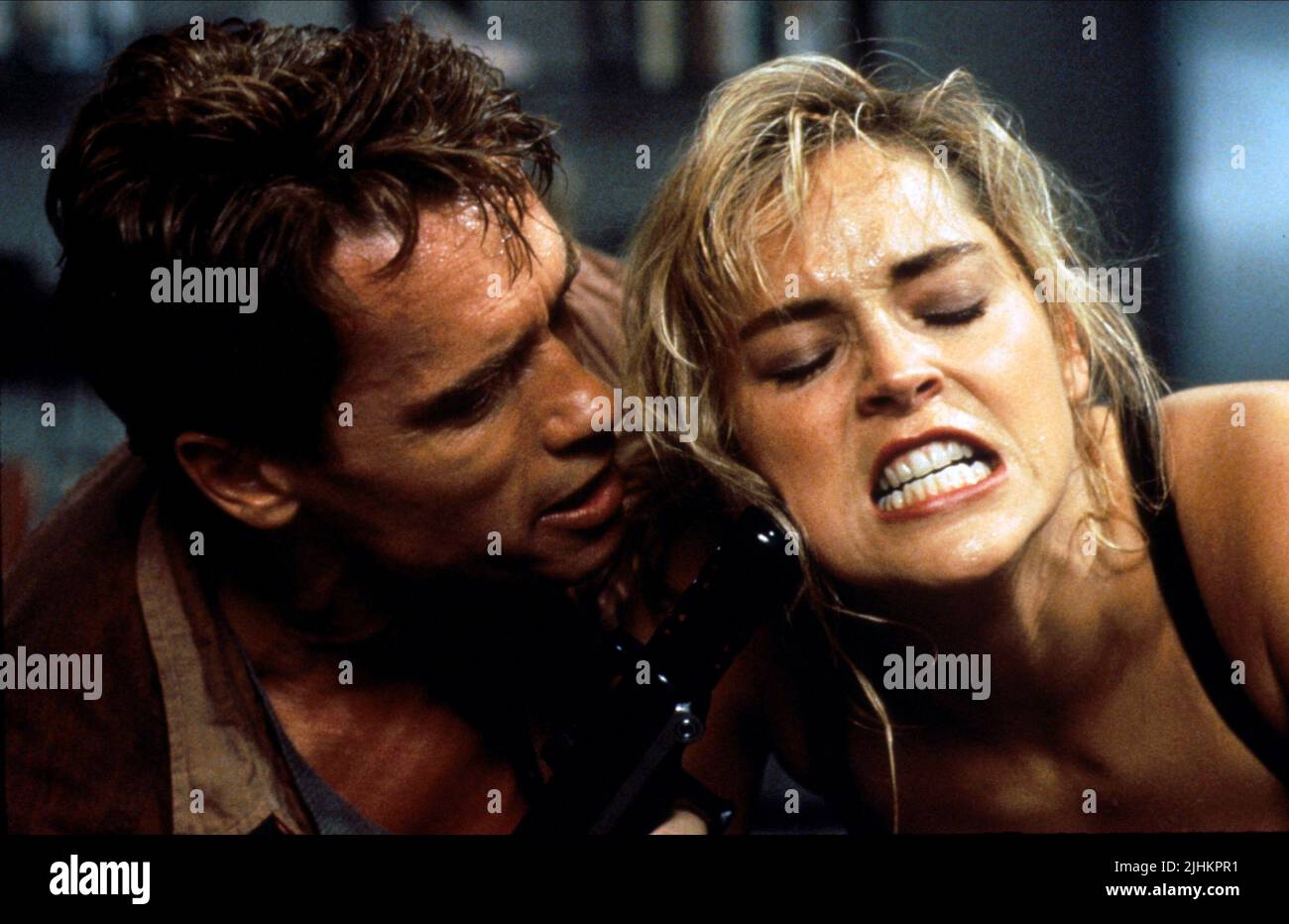 ARNOLD SCHWARZENEGGER, SHARON STONE, TOTAL RECALL, 1990 Stock Photo