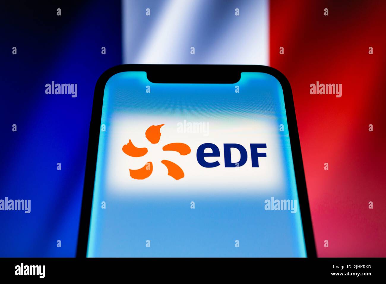 Asuncion, Paraguay. 19th July, 2022. Logo of EDF displayed on a smartphone backdropped by cropped waving flag of France. The French government on Tuesday outlined its plans to take full control of energy company EDF. The offer is expected by the French State to be filed with the French Financial Markets Authority by early September 2022, subject to enactment of a 2022 Supplementary Budget Bill providing the financial resources necessary for the offer. (Credit Image: © Andre M. Chang/ZUMA Press Wire) Stock Photo