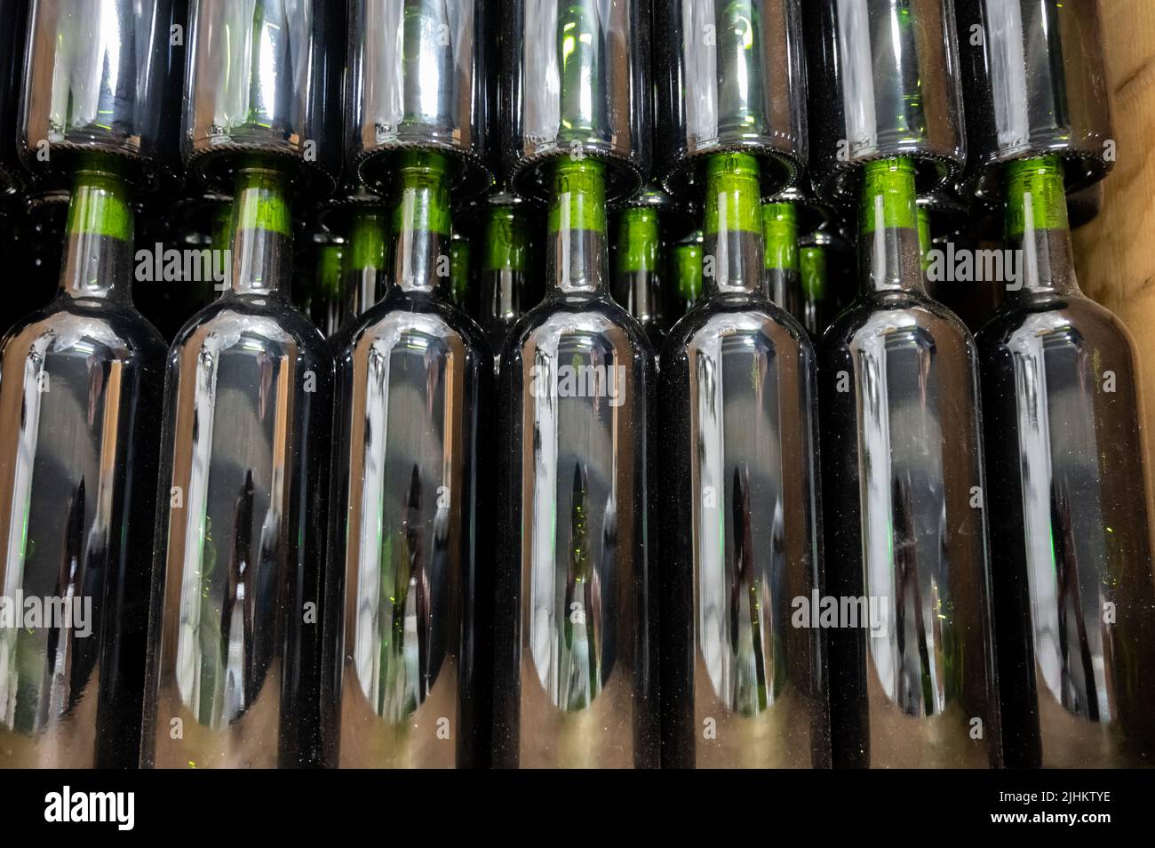 Bottles of wine without labels in box, producing of red, rose and white