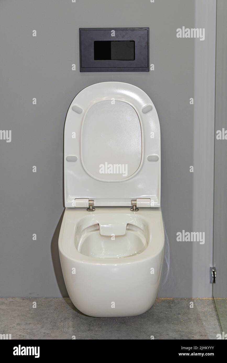 Wall Mounted Toilet Seat With Open Cover Stock Photo
