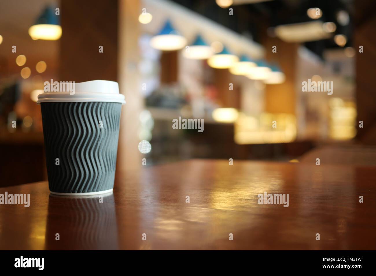take away paper coffee cup o on cafe table Stock Photo - Alamy