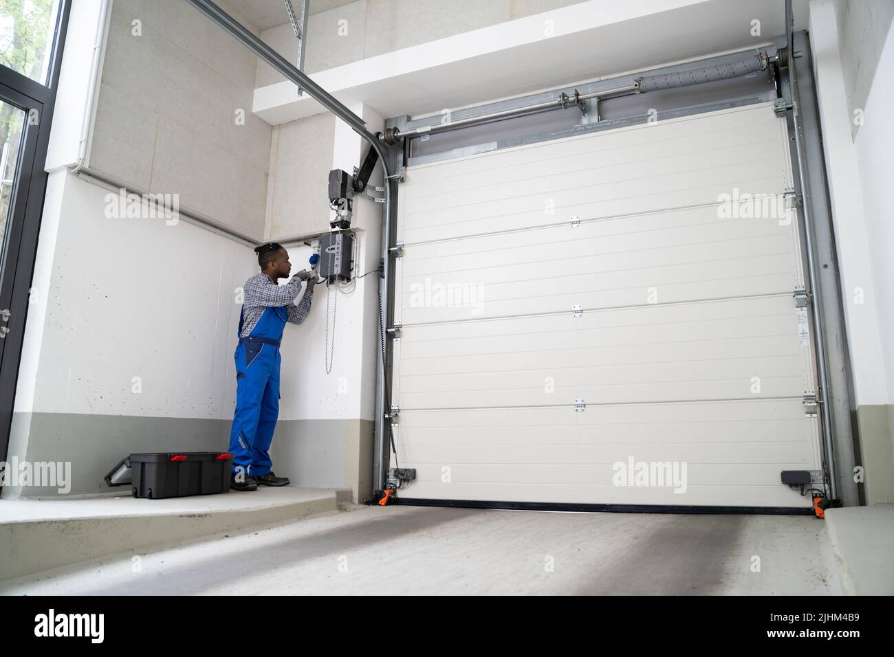 Installing Automatic Garage Door Or Gate. Maintenance And Repair Stock Photo Alamy