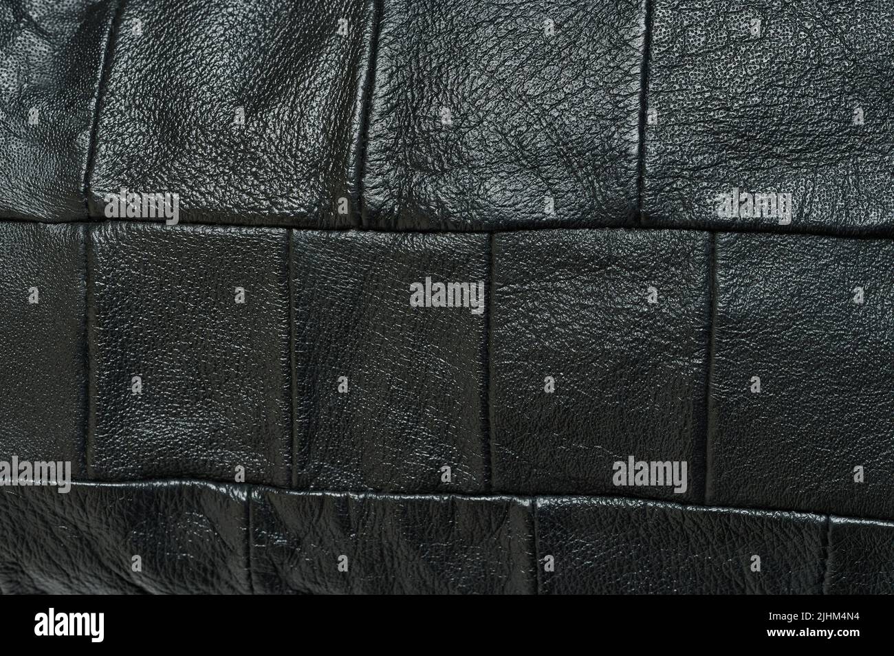 Pressed black leather pattern abstract background close up view Stock Photo