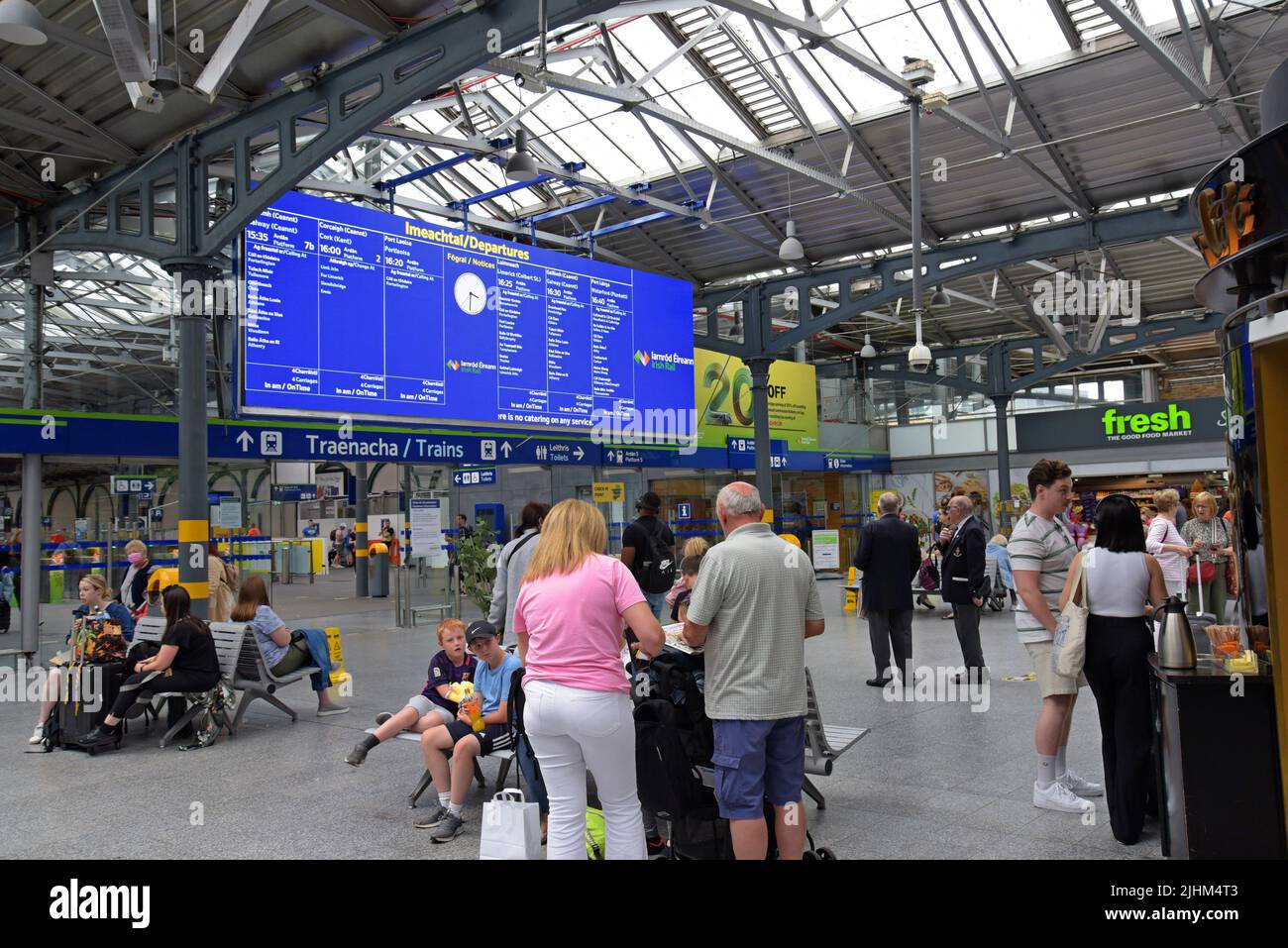 Irish Rail passengers at Dublin Heuston Station waiting for trains on