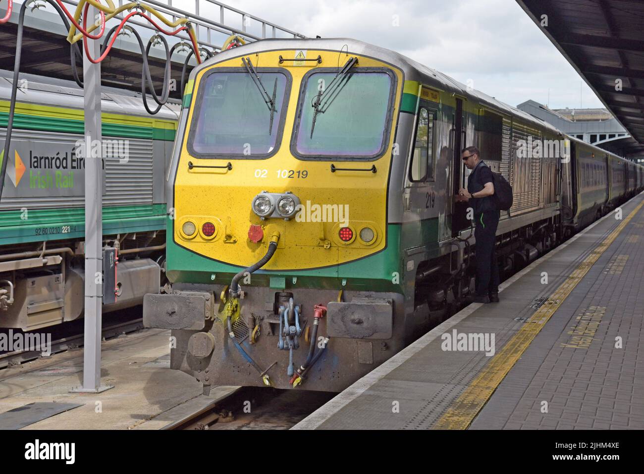 Train driver getting into the cab of his Irish Railways main line express passenger