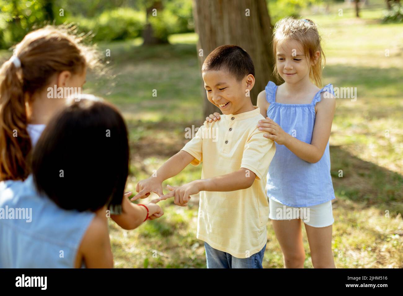 Group of cute asian and caucasian kids having fun in the park Stock ...
