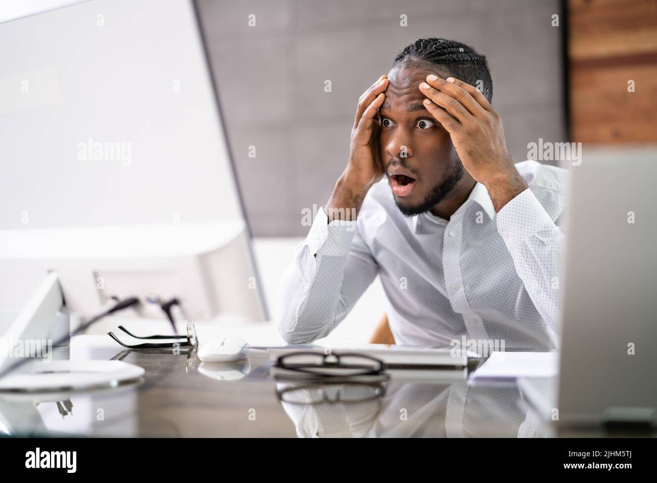 Computer Laptop Surprise At Workplace. Man Forgot Password Stock Photo