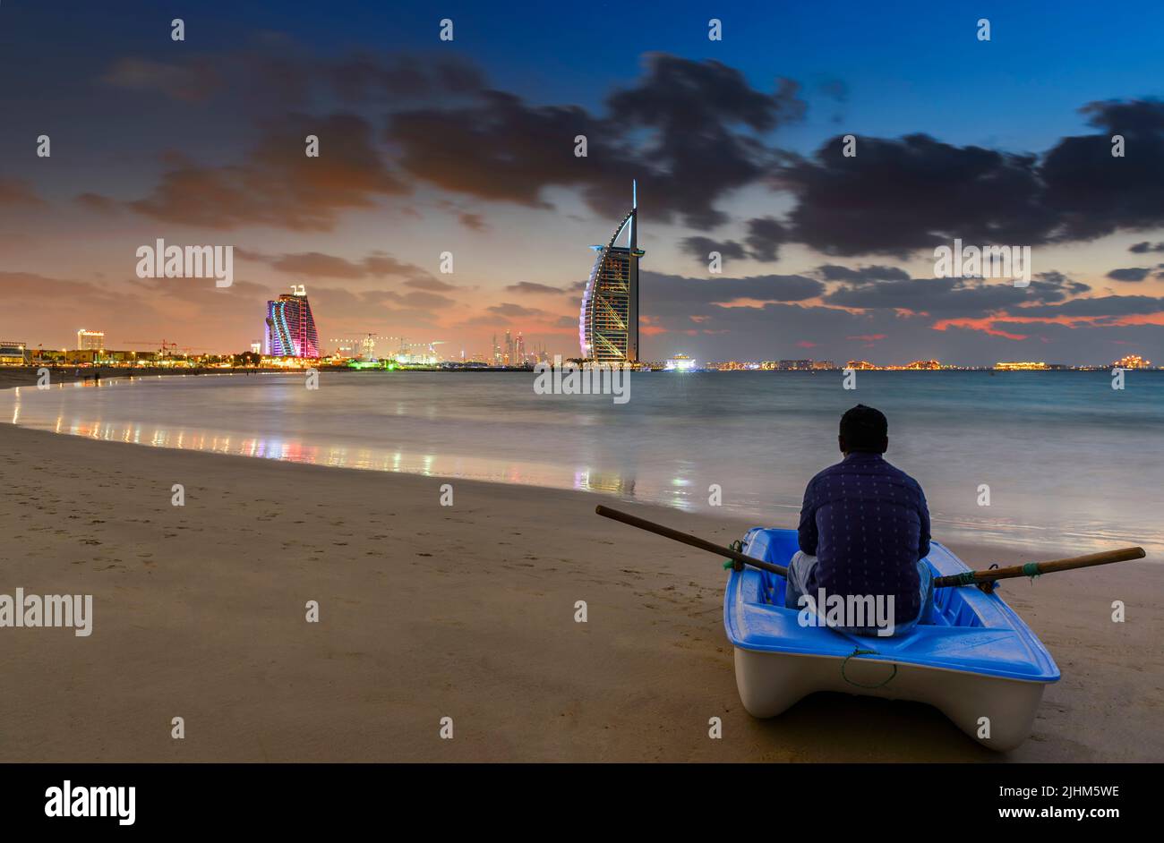 Man sitting on boat dubai hi-res stock photography and images - Alamy
