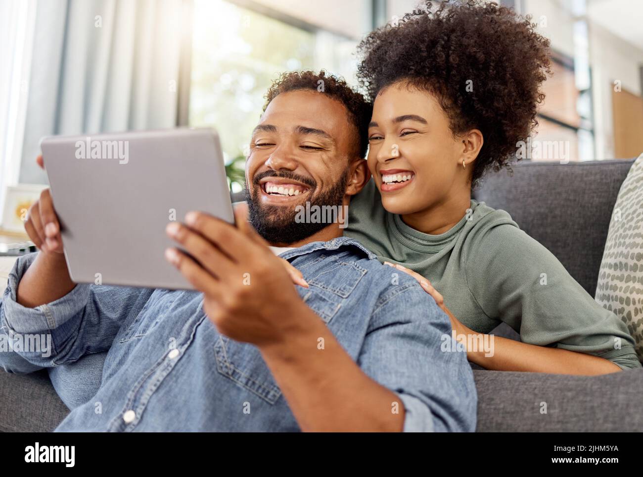 Hispanic man smiling tablet hi-res stock photography and images - Alamy
