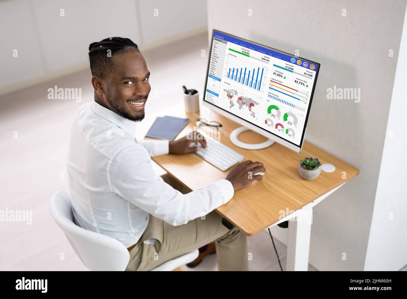 Analyst Man Looking At Business Data Analytics Dashboard Stock Photo