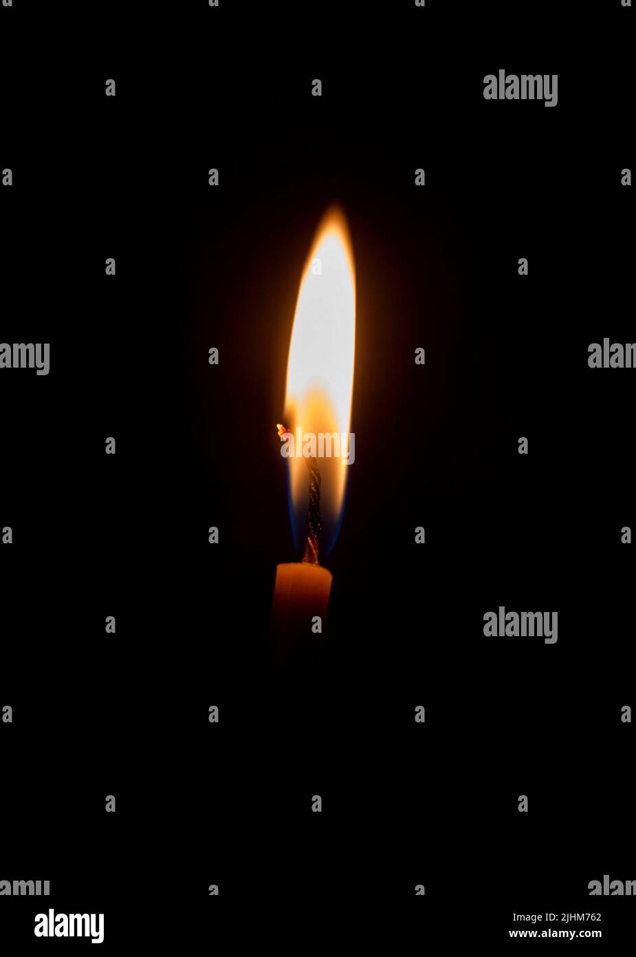 Religious candle in the dark Stock Photo Alamy