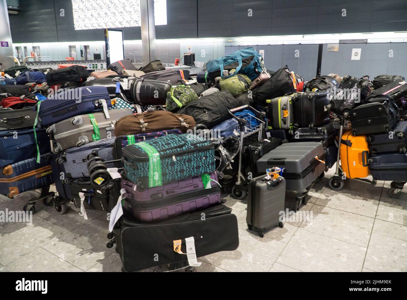 Heathrow, UK, 17 July 2022: A large number of checked suitcases separated from their owners at Heathrow airport Terminal 5. Anna Watson/Alamy Live News Stock Photo
