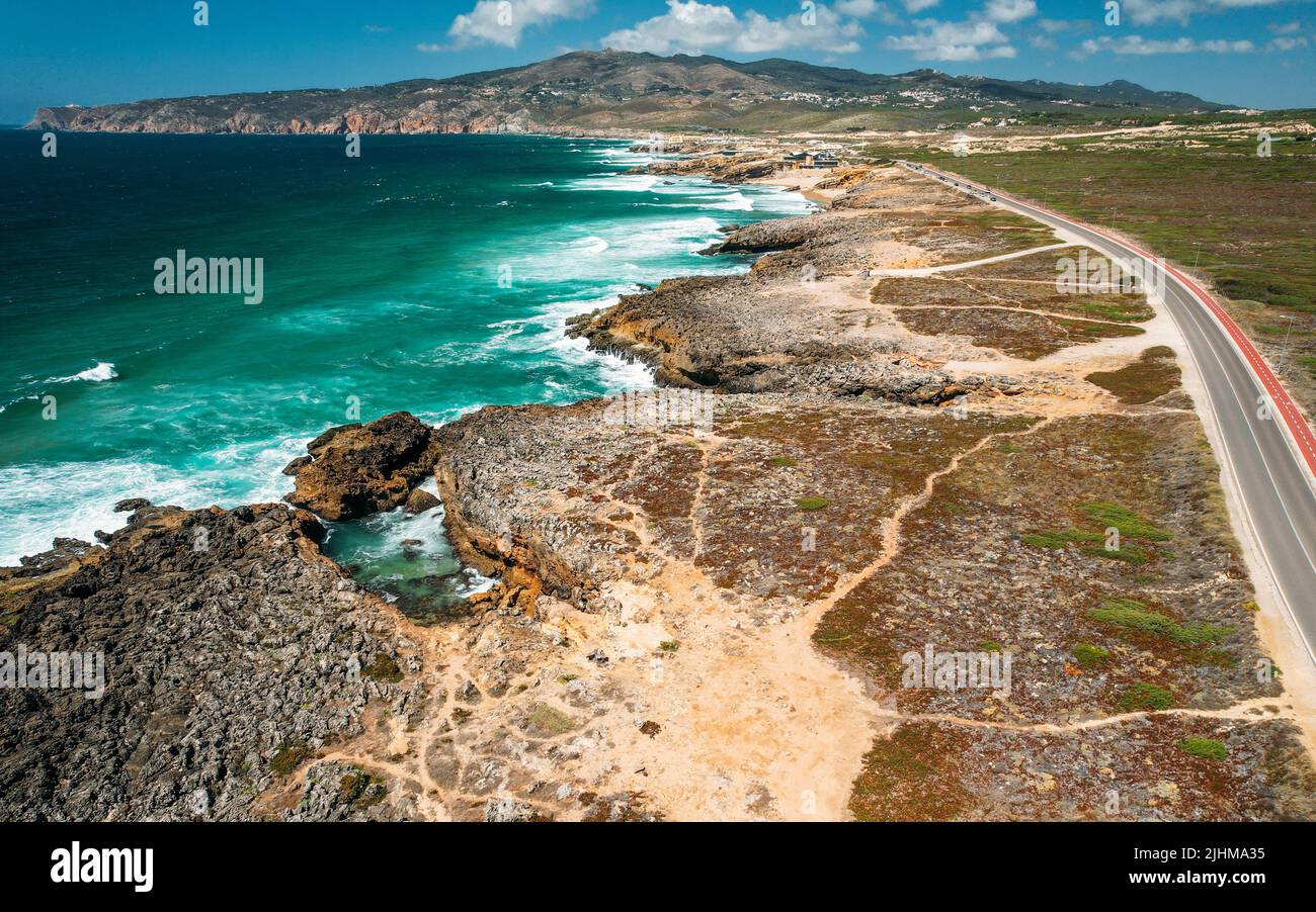 Aerial view view of of a N247 street with rugged coastline at Guincho beach, Cascais, Portugal Stock Photo