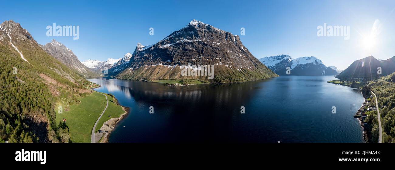 Aerial panoramic view over fjord Hjorundfjord, from village Oye (left) to Urke (right),  mt. Stalbergneset (middle), Norway Stock Photo