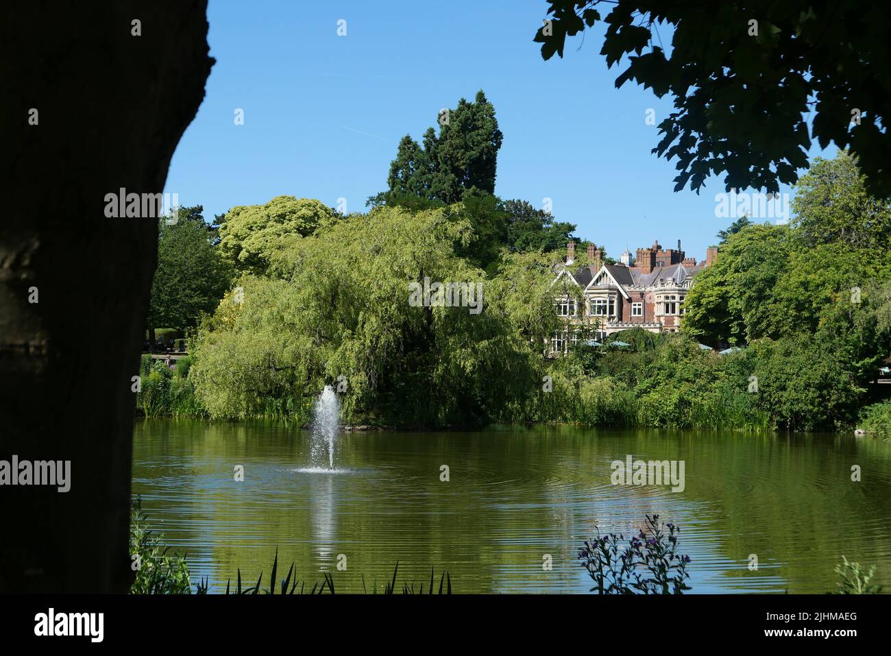 Bletchley Park Manor House with the lake in the foreground Stock Photo