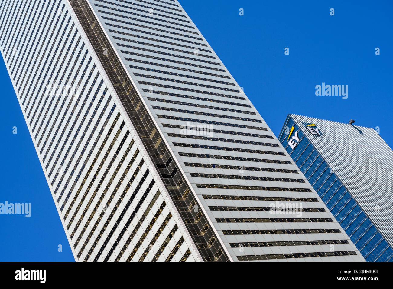 Bank of Montreal (BMO) building towering next to Ernst & Young (EY) office building seen from Bay Street, downtown Toronto, Ontario, Canada. Stock Photo