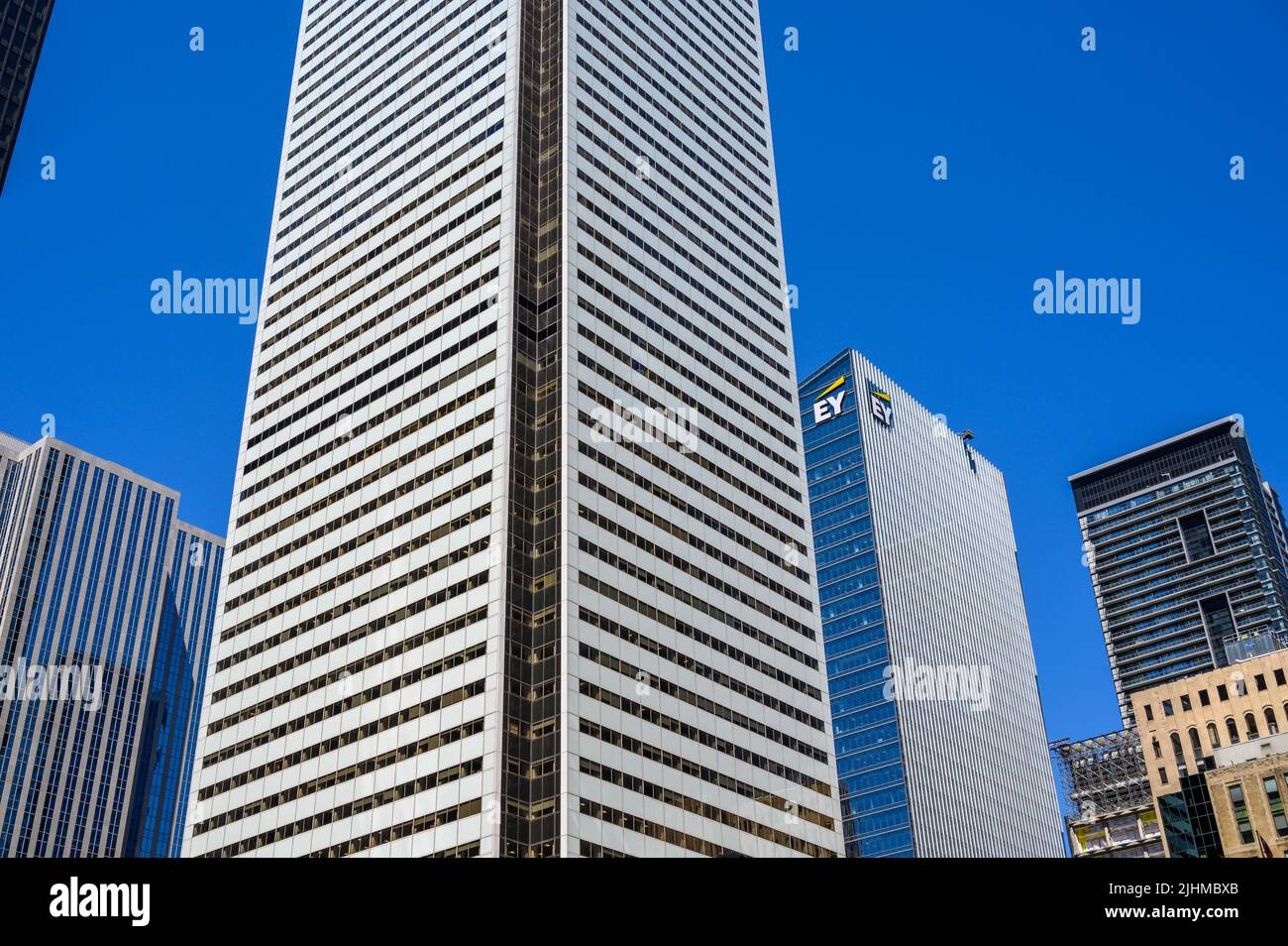 Bank of Montreal (BMO) building towering next to Ernst & Young (EY) office building seen from Bay Street, downtown Toronto, Ontario, Canada. Stock Photo